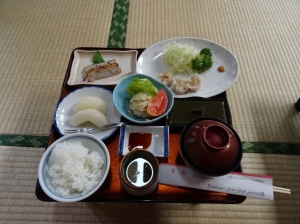 Fish cakes, dumplings, nashi, some sort of potato salad, rice, green tea and miso.